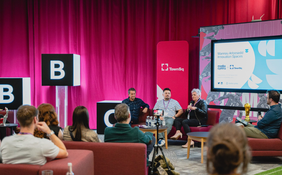 innovation-spaces Four people giving a presentation to an audience at the BBC