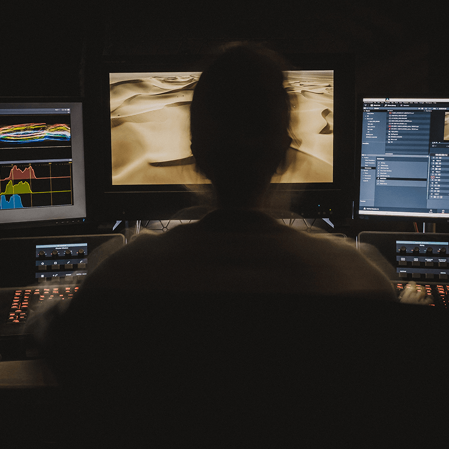 Editor working at a media desk.