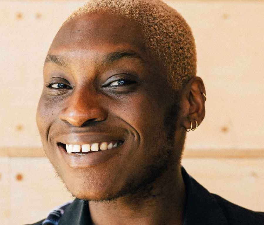 Photo of Laolu Alatise smiling.