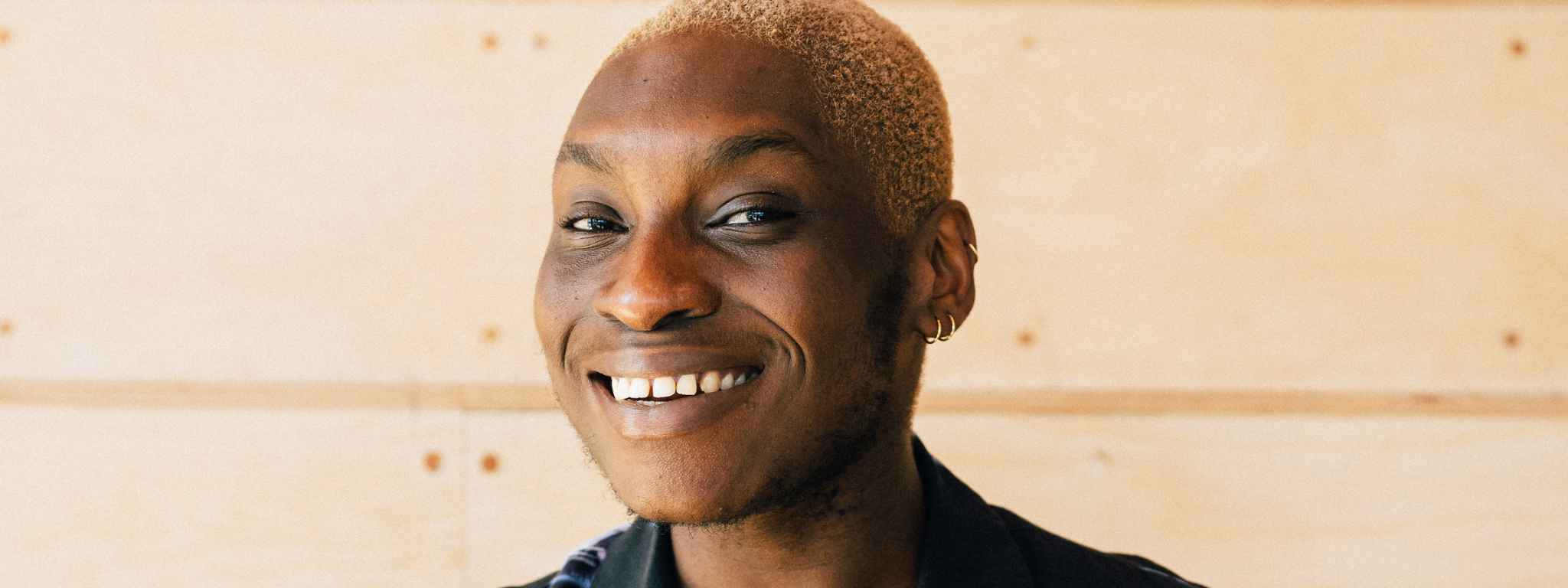 Photo of Laolu Alatise smiling.